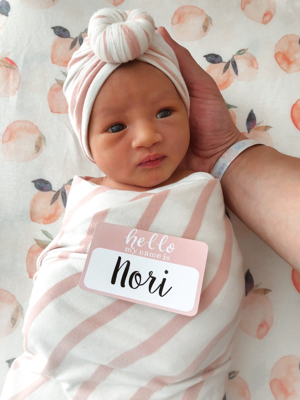 newborn baby girl hospital photo name tag swaddle